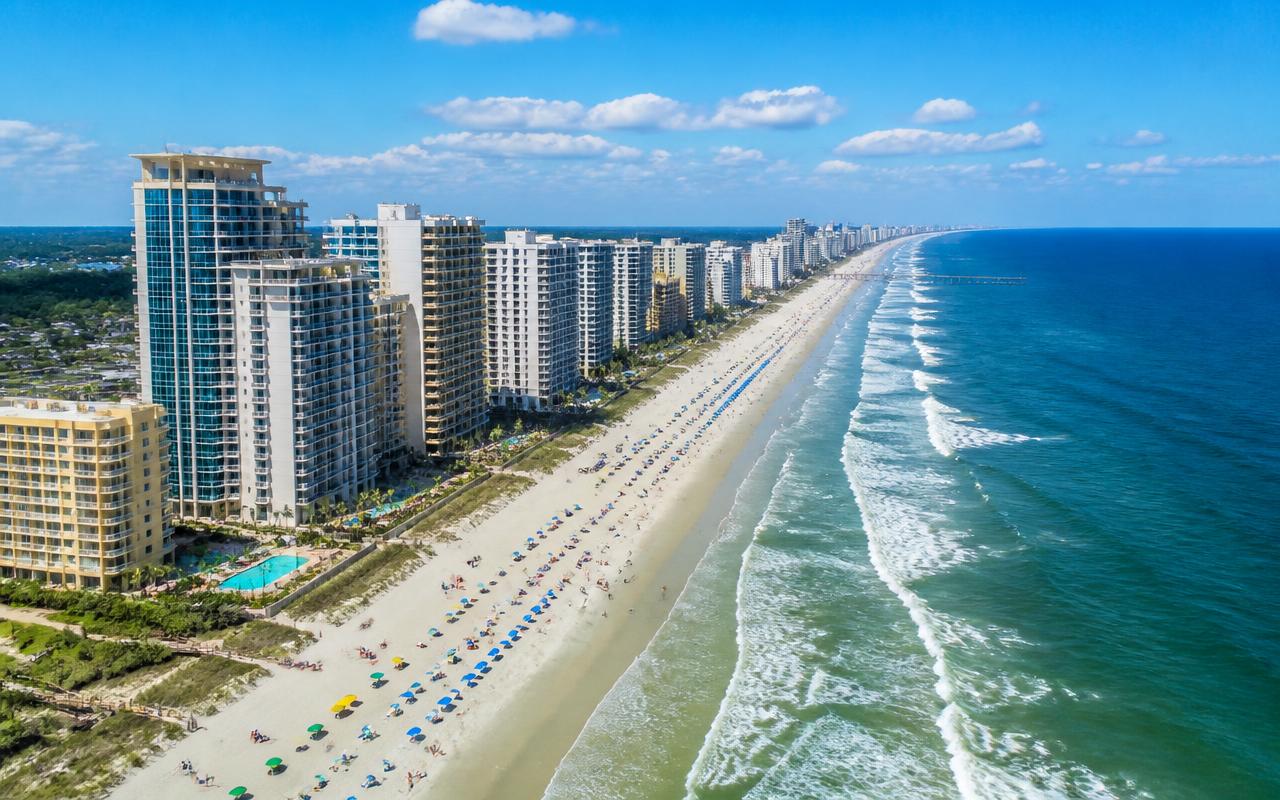 Aerial view of Myrtle Beach South Carolina oceanfront condo towers and the wide Atlantic beach